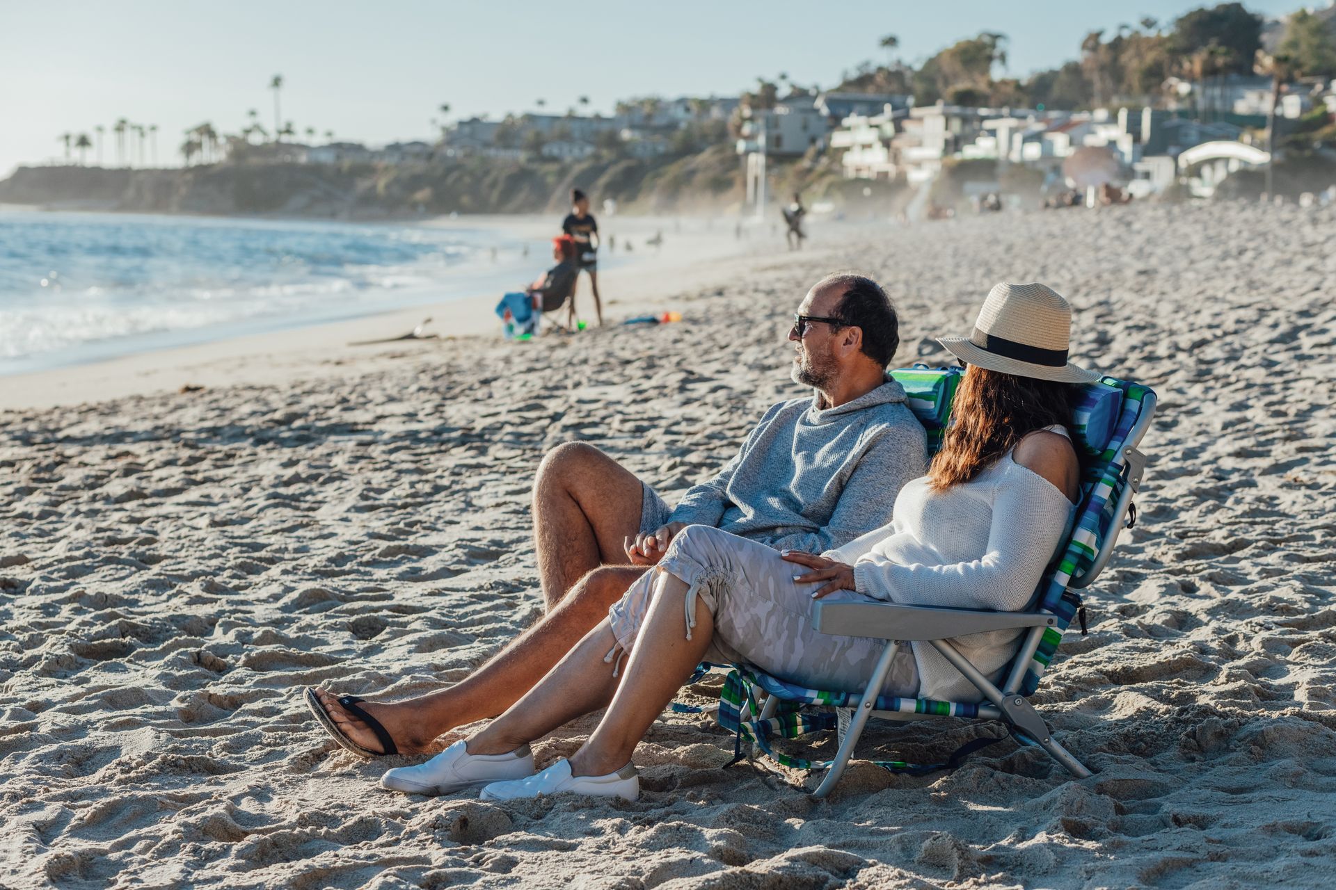 Couple relaxing in beach chairs on a Southern California beach