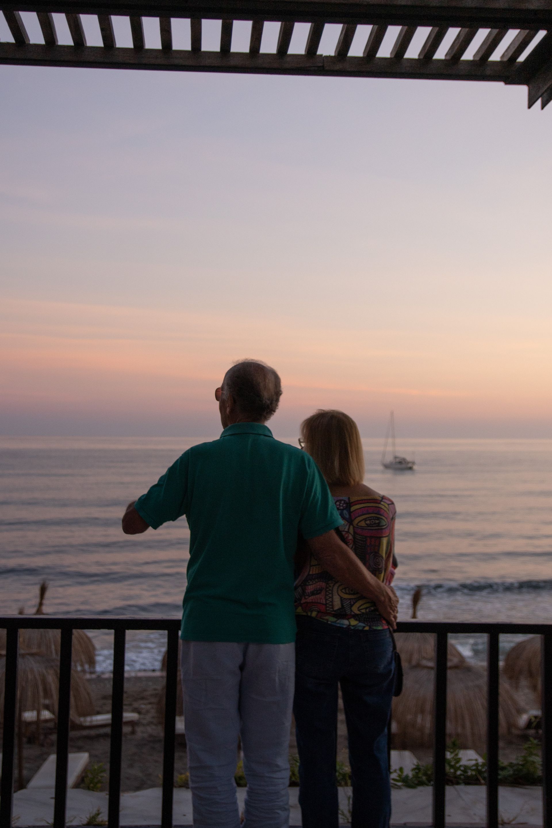 Couple watching the sunset over the Pacific Ocean